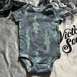 Carter’s baby boy onesie with alligator design